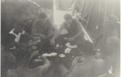 group of men playing cards